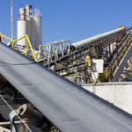 Multiple conveyor belts are used at a processing site.